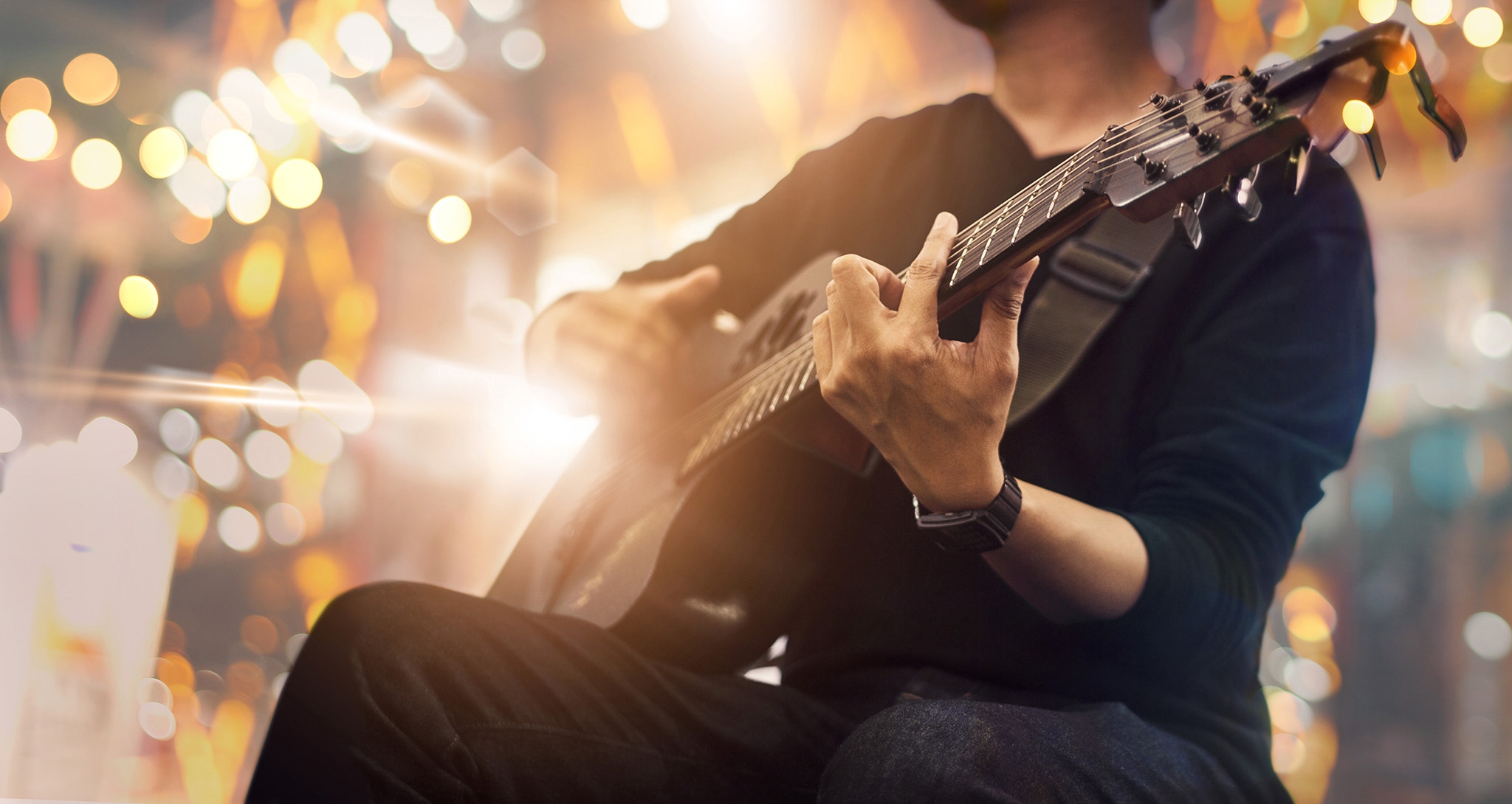 Guitarist on stage and sings in a concert for background, soft a Guitarist on stage and sings in a concert for background, soft a