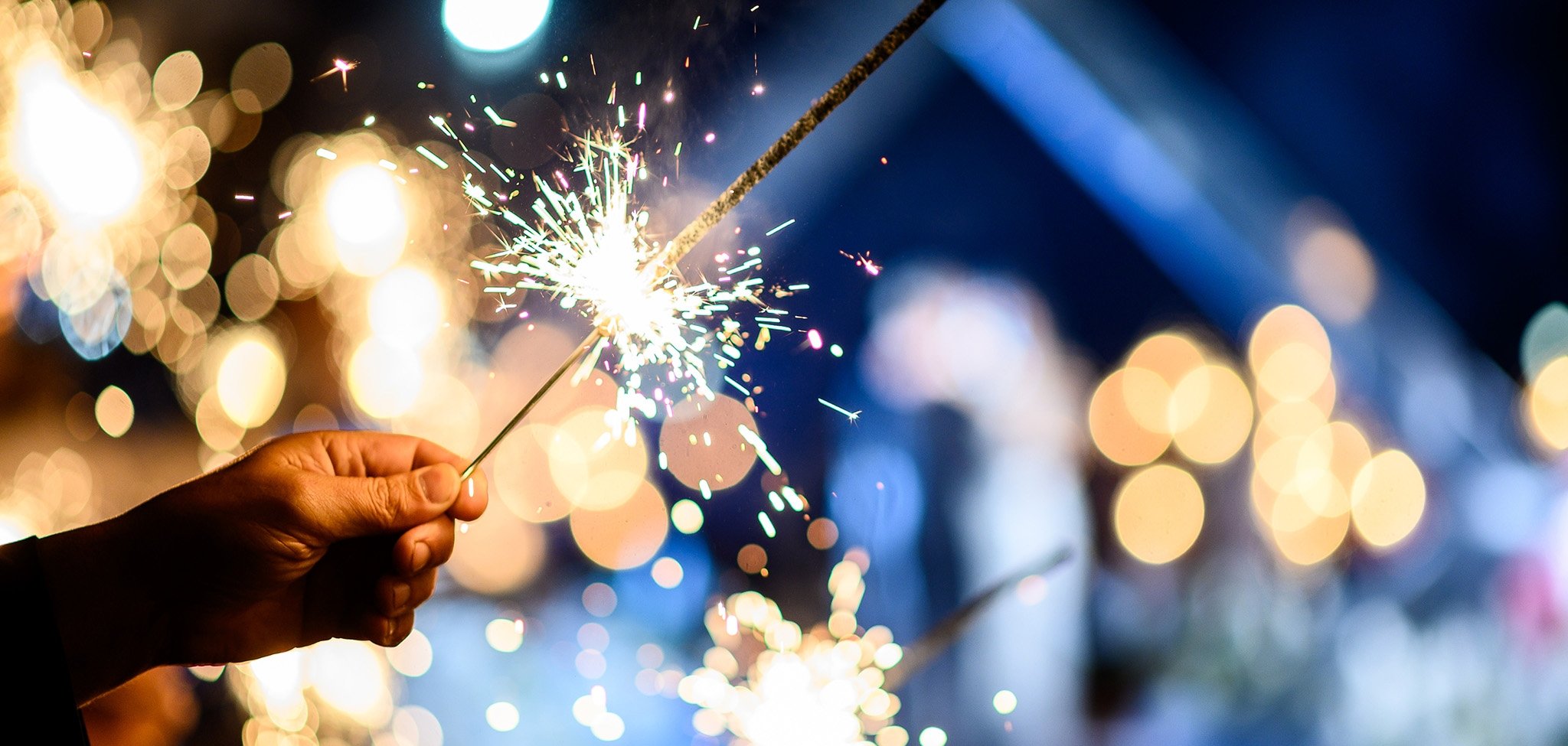 Man hand holding a burning sparkler. Bengal fire