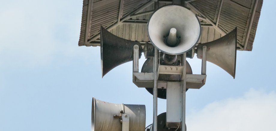 Vintage horn speaker tower with loudspeaker against the sky. Sys